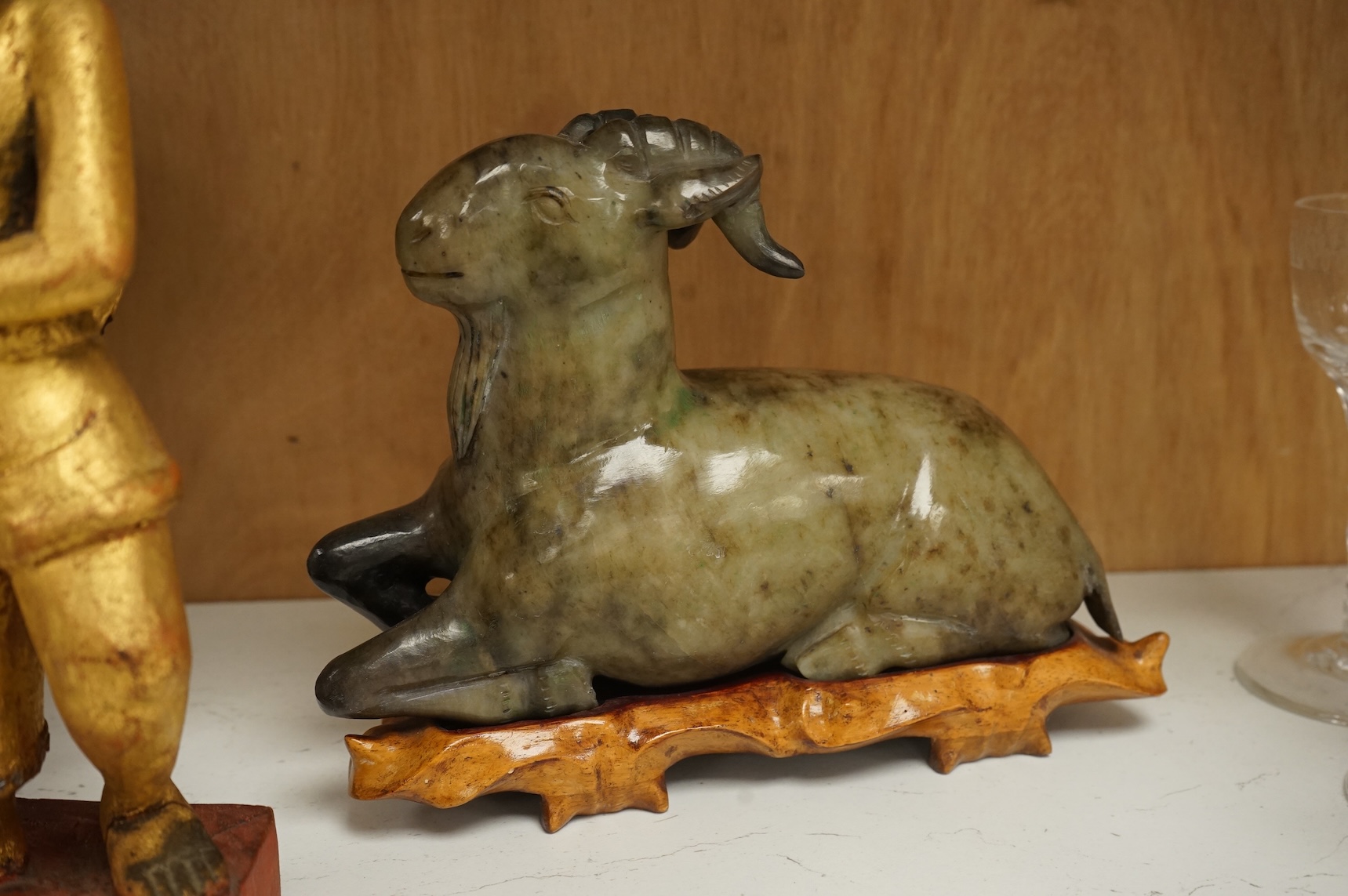 Two modern jade figures, together with a marble Buddha and a carved giltwood figure, largest 24cm wide